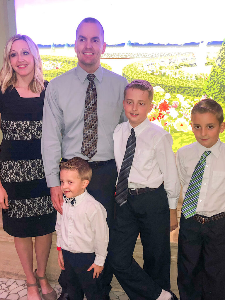 A family dressed up for formal night on a Disney Cruise.