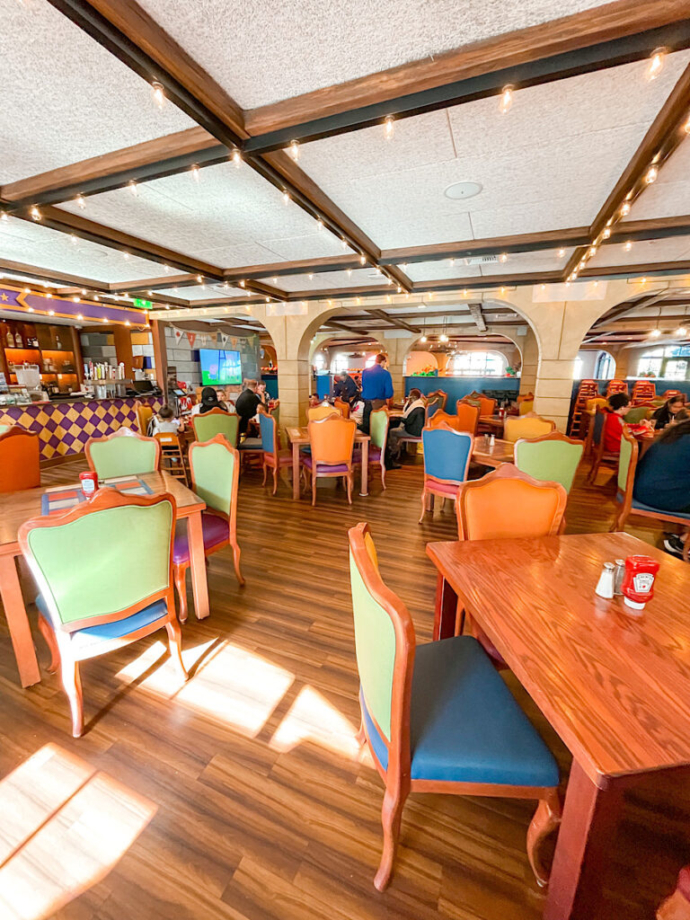 Dining area of Dragon's Den restaurant at Legoland Castle Hotel.