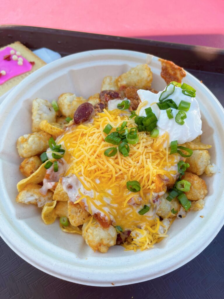 A bowl of Totchos (or tater tot nachos) from Woody's Lunch Box at Disney World.