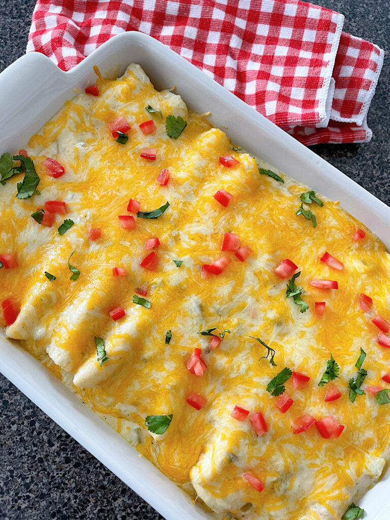 A pan of sour cream chicken enchiladas.