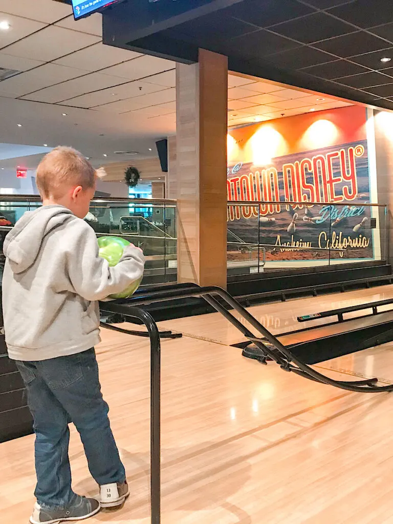 A child at a bowling alley at Splitsville Anaheim.