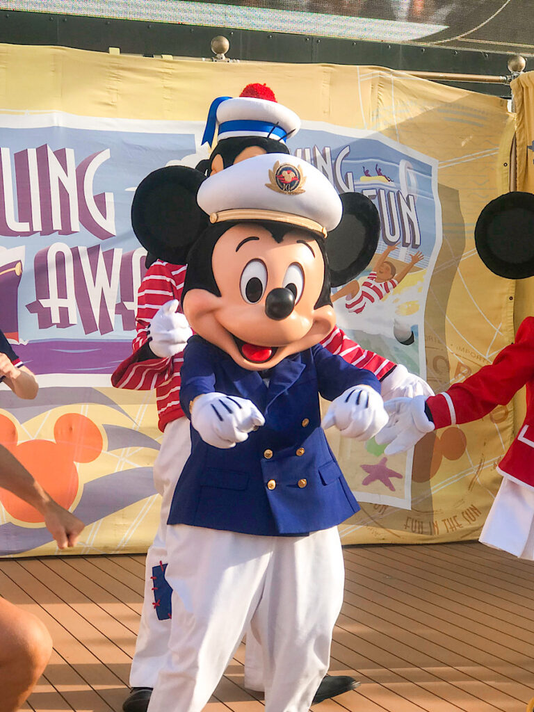 Mickey Mouse dressed as a ships captain on a Disney cruise.