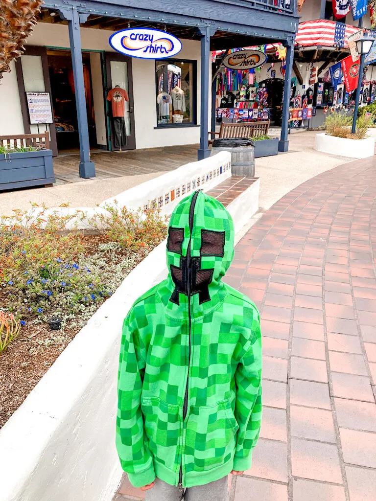 A child in front of stores in Seaport Village in San Diego, California.