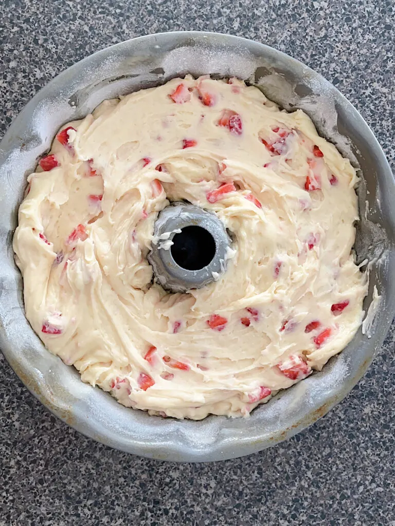 Strawberry bundt cake batter in a bundt pan.