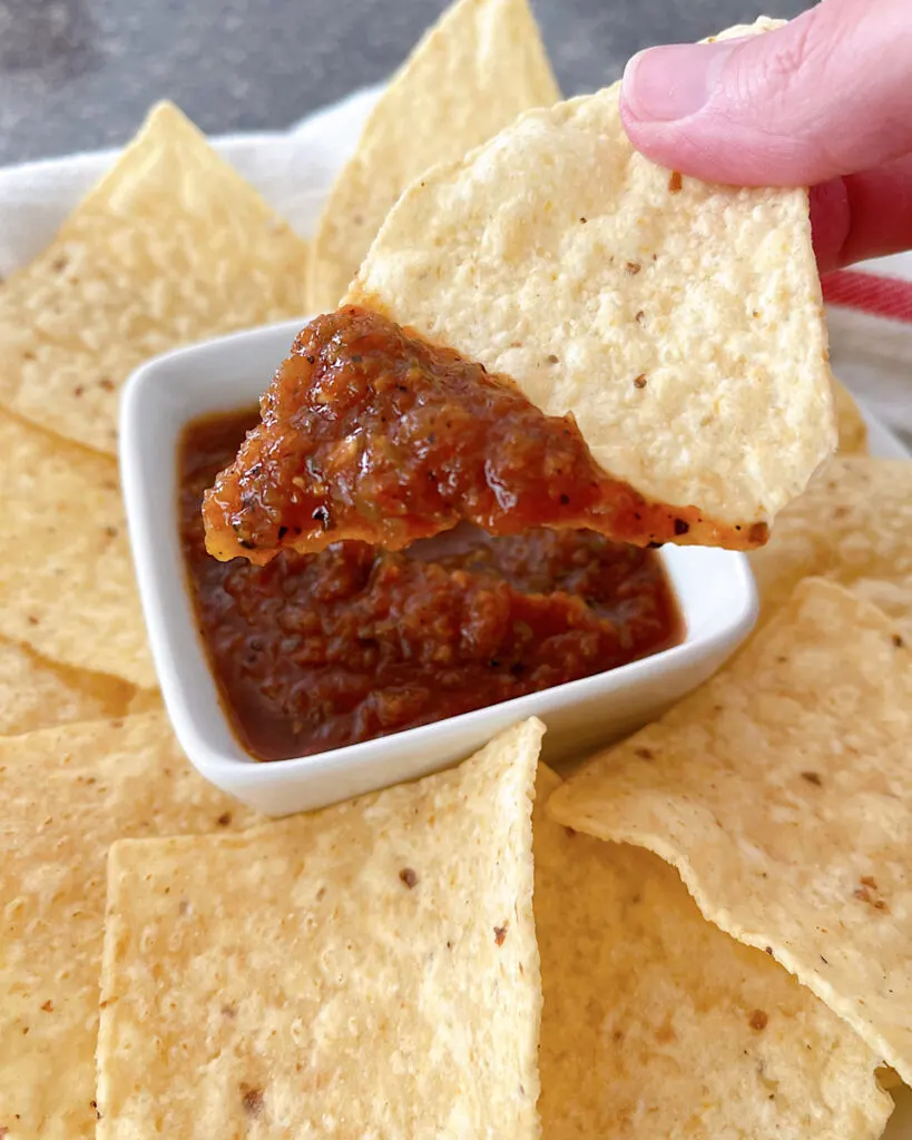 Salsa made with canned tomatoes on a tortilla chip.