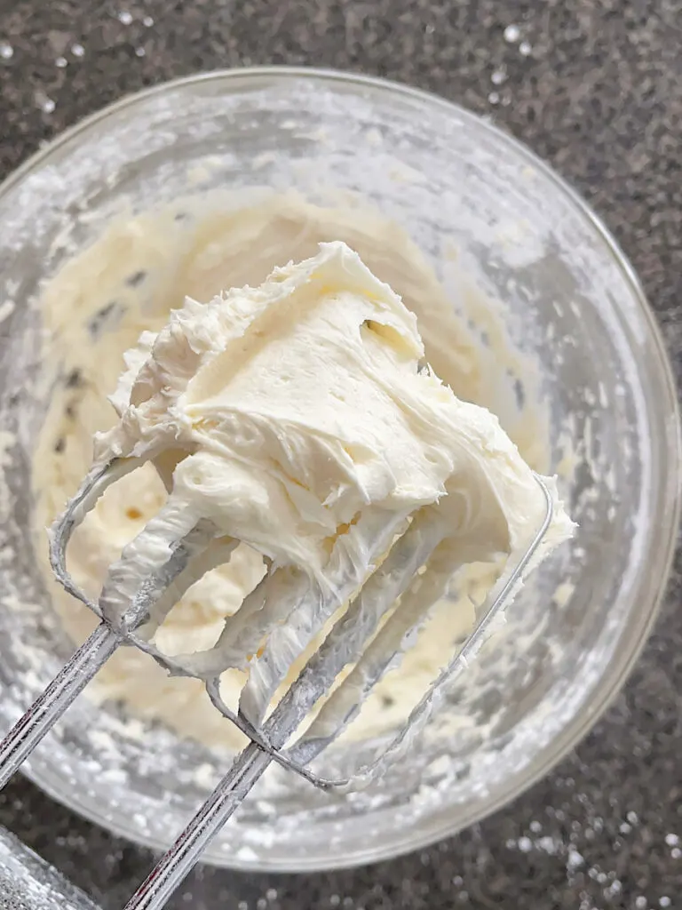 White chocolate buttercream frosting in a mixing bowl.