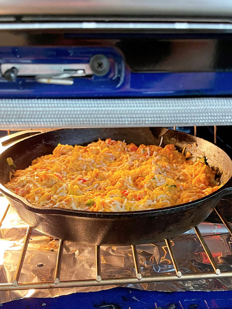 Spicy Mexican Casserole under the broiler in the oven.
