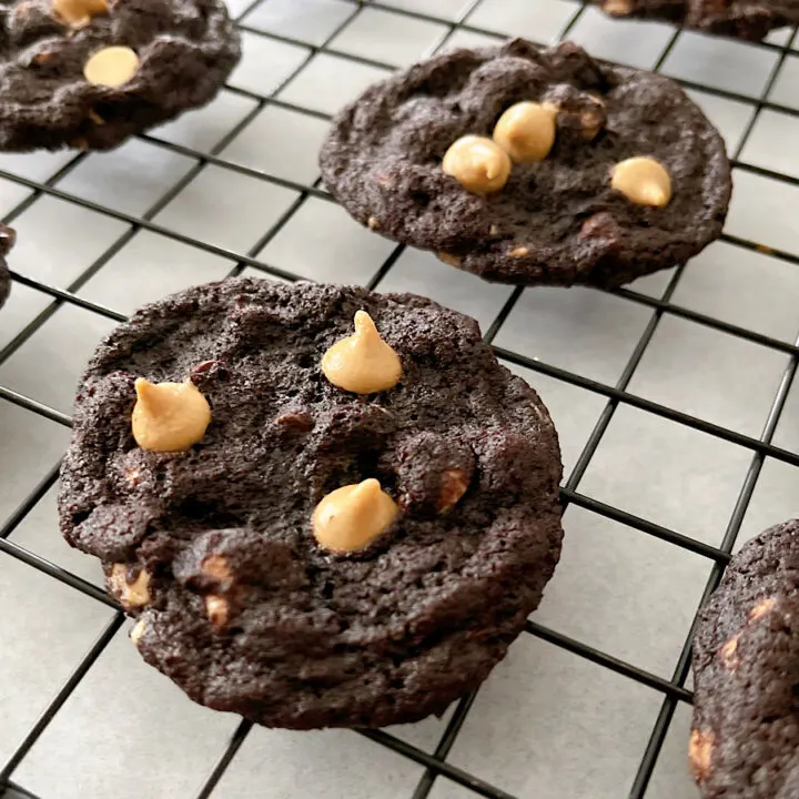 Reese's Chocolate Peanut Butter Chip Cookies on a cooling rack.