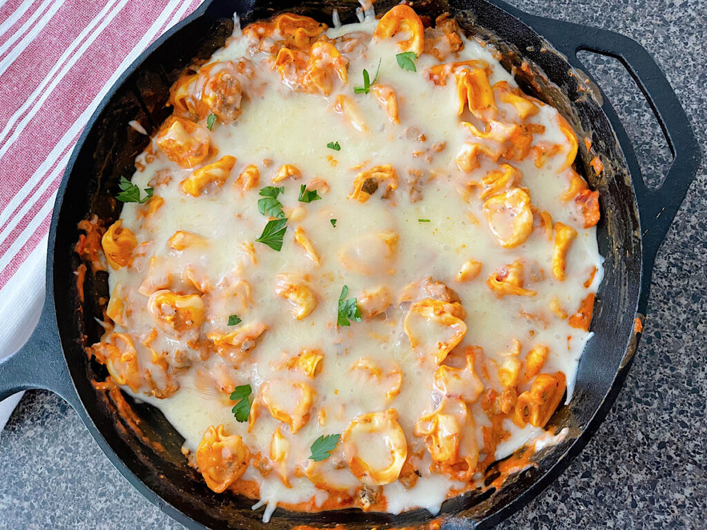 An easy tortellini bake in a cast iron skillet.