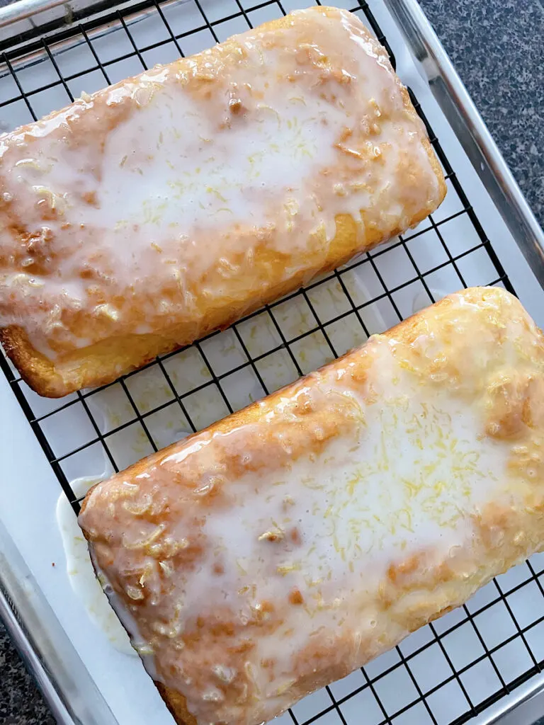 Two loaves of iced lemon bread.