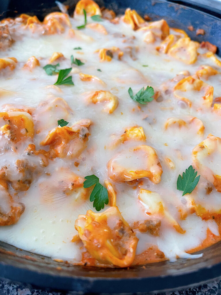 An easy tortellini bake in a cast iron skillet.