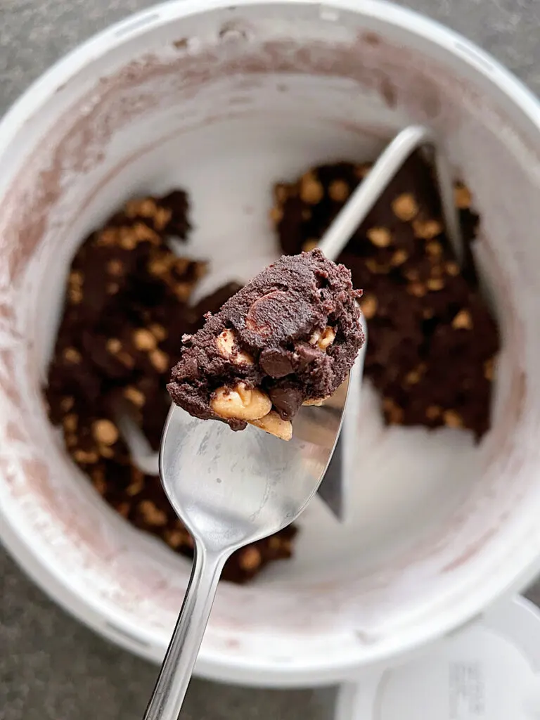 A spoon of chocolate cookie dough.