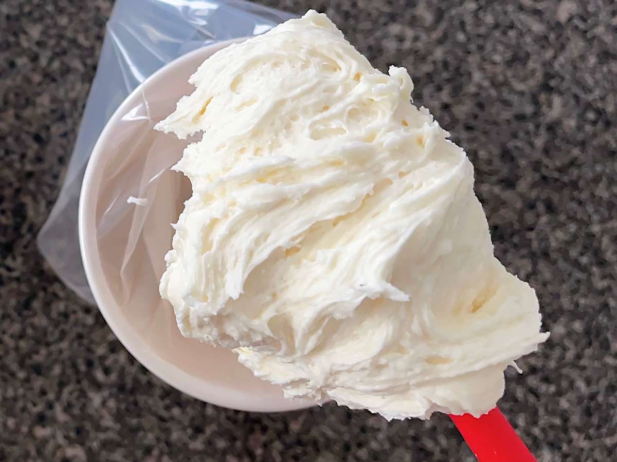 White chocolate buttercream on a red spatula.