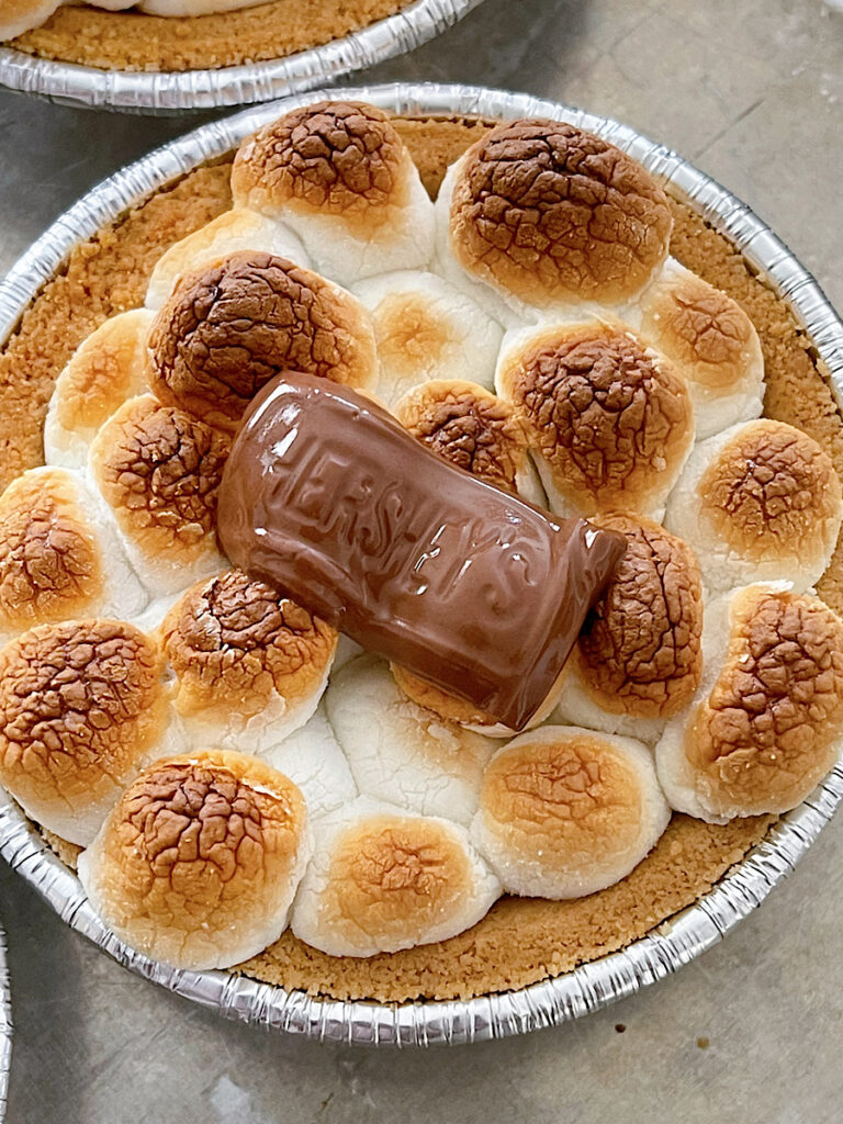 A mini s'mores pie with toasted marshmallows and Hershey's chocolate.
