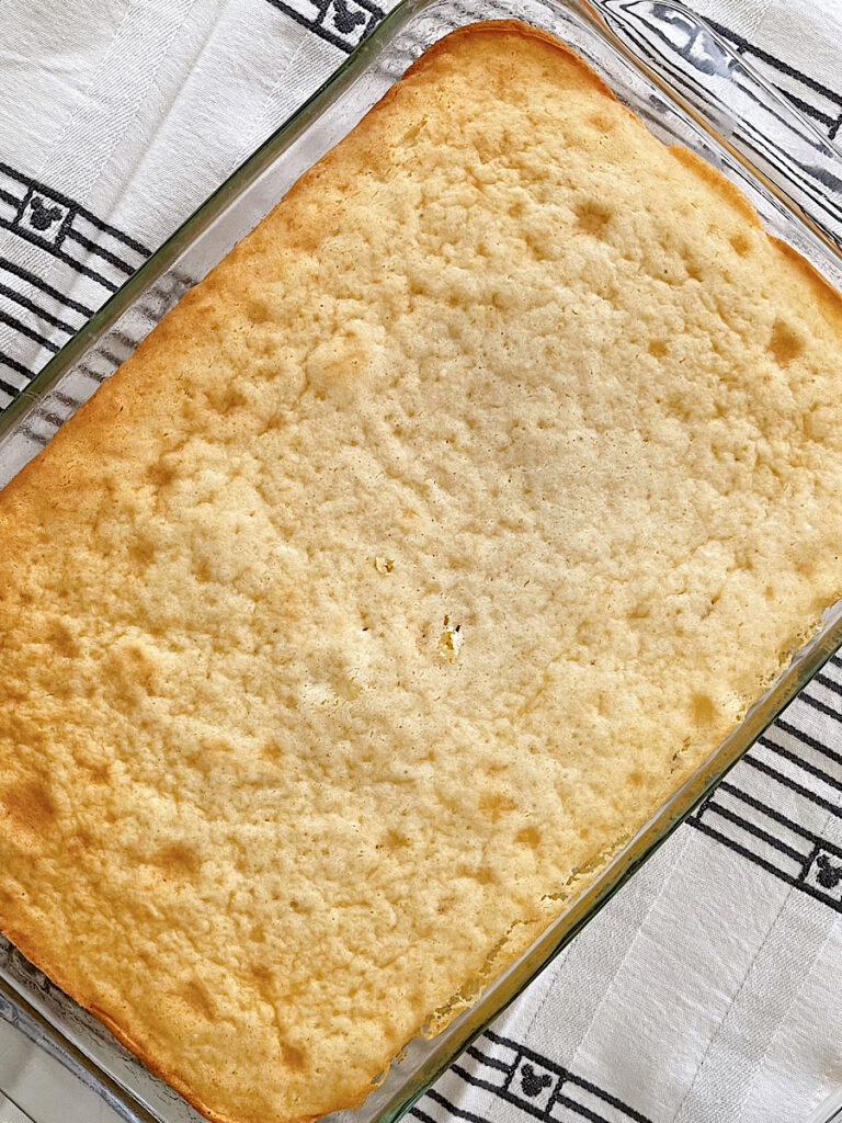A white cake in a 9x13 pan.