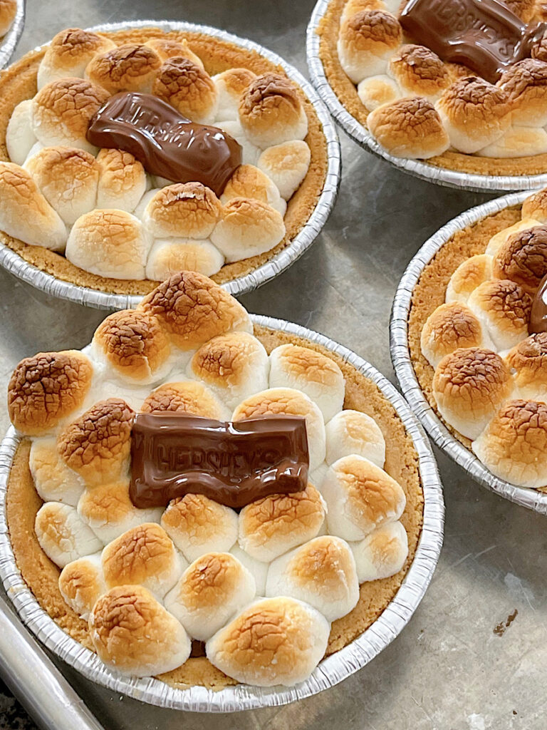 A mini s'mores pie with toasted marshmallows and Hershey's chocolate.