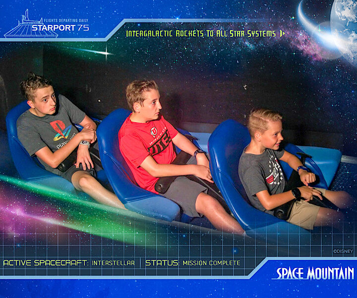 Three boys riding Space Mountain at Magic Kingdom.