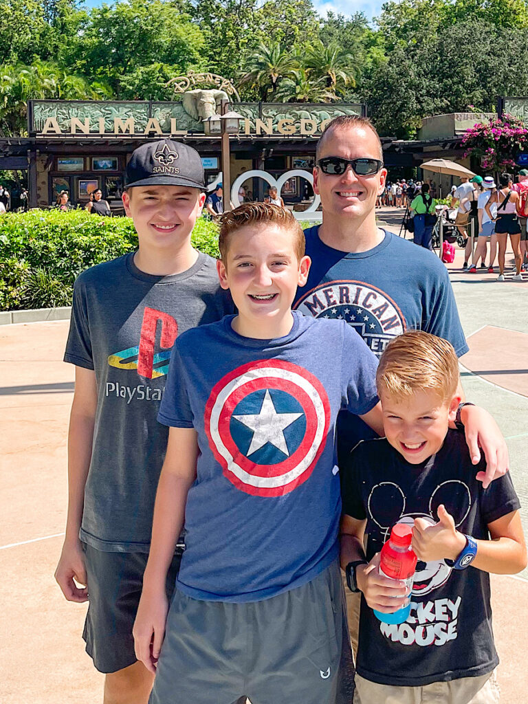 A family in front of the entrance to Disney's Animal Kingdom Park.