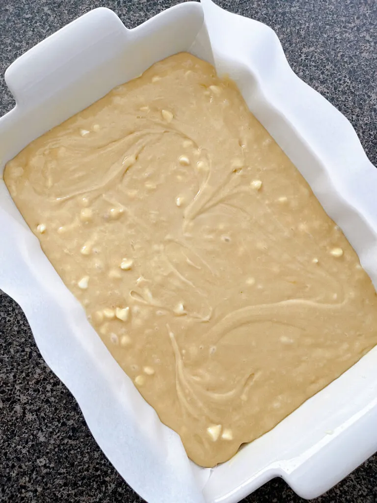 White chocolate brownie batter in a baking dish.