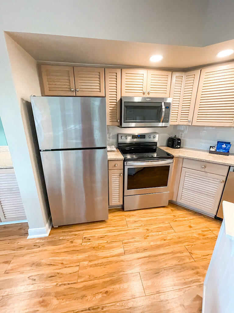 Fridge, range, and microwave in 1-bedroom Old Key West Resort suite.