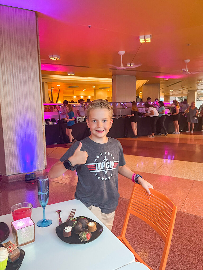 A child at a Magic Kingdom dessert party.
