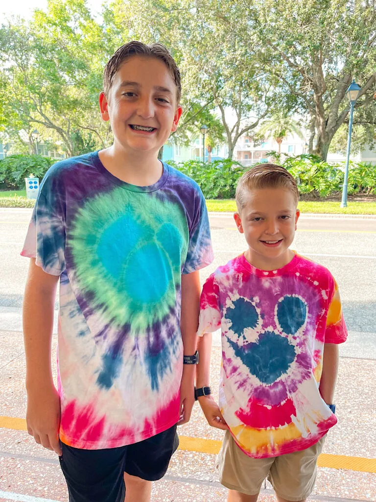 Two kids wearing Mickey Mouse tie-dyed shirts made at Old Key West Resort.