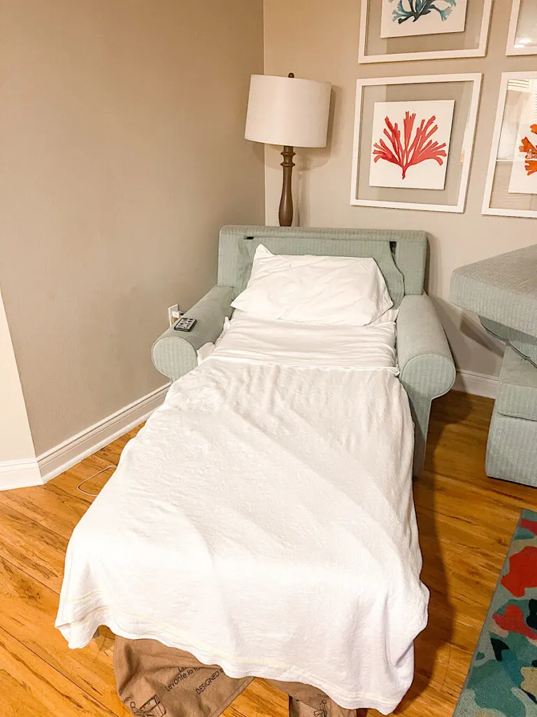 A chair in a 1-bedroom suite at Disney's Old Key West folded out into a twin bed.