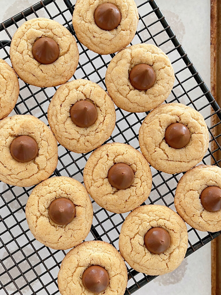 Peanut Butter Hershey Kiss cookies on a cooling rack.