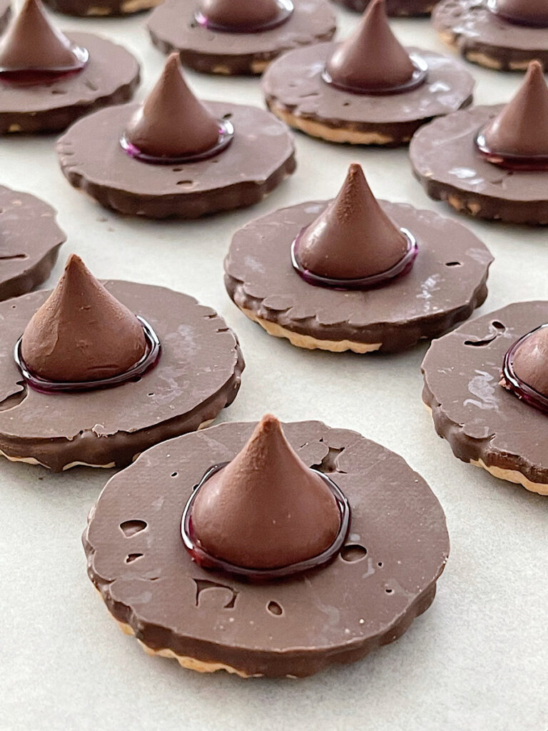 Witch hat cookies made from fudge stripe cookies and Hershey's kisses.