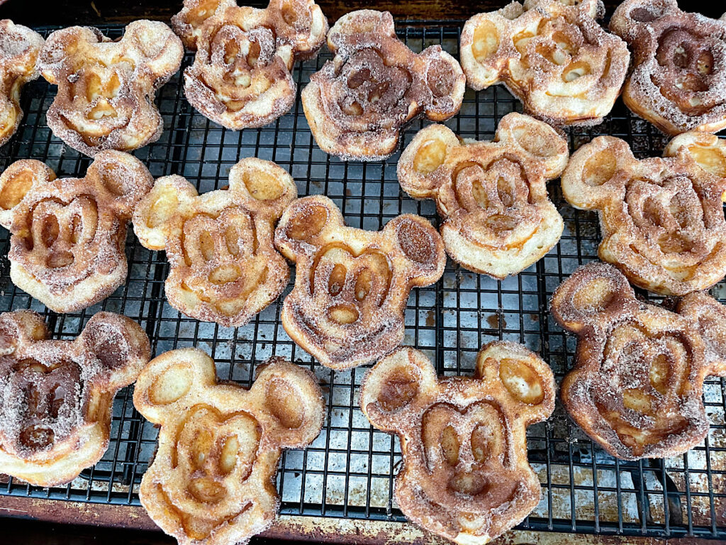 Mickey waffles coated in butter and cinnamon sugar.