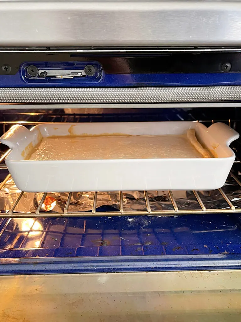 A crescent pumpkin cream cheese bake in the oven.