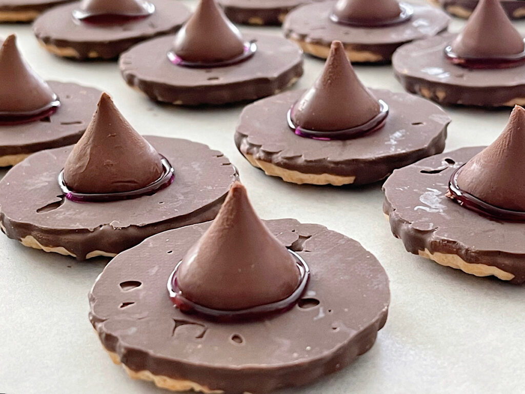 Witch hat cookies made from fudge stripe cookies and Hershey's kisses.