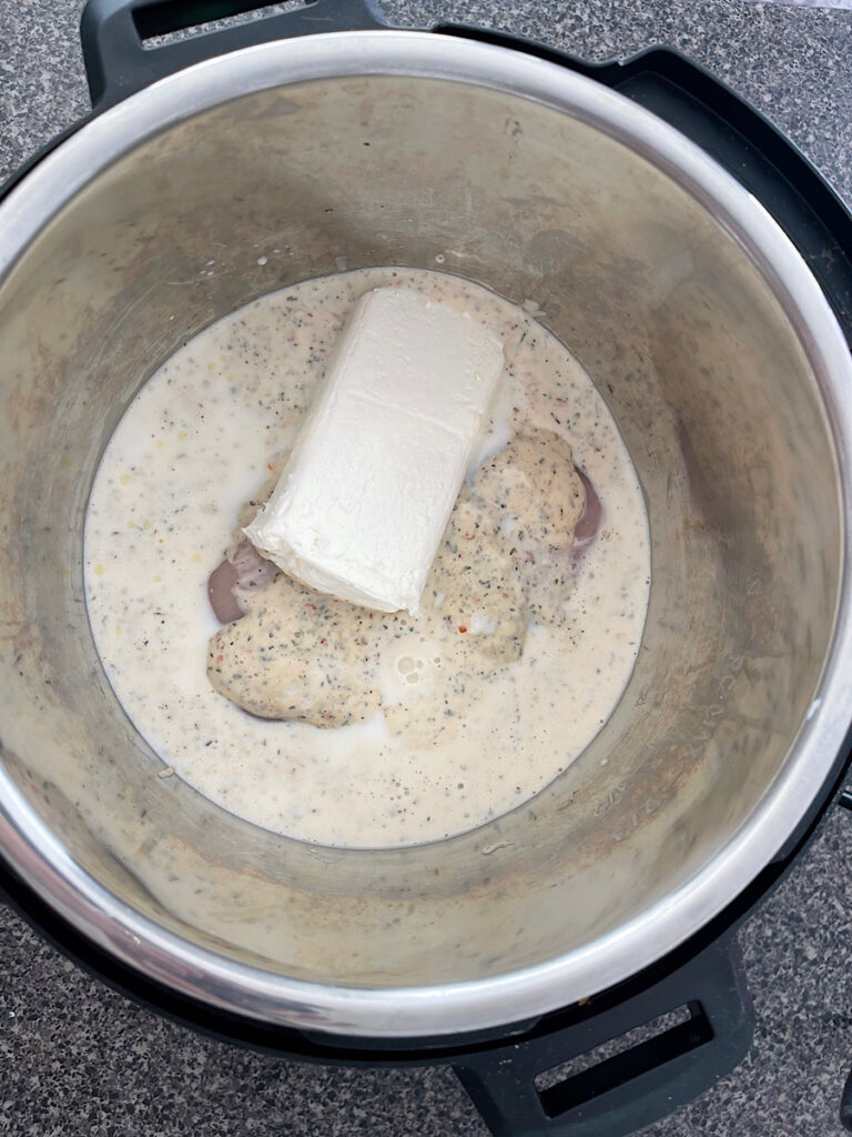 Garlic parmesan sauce, milk, chicken, and cream cheese in an Instant Pot