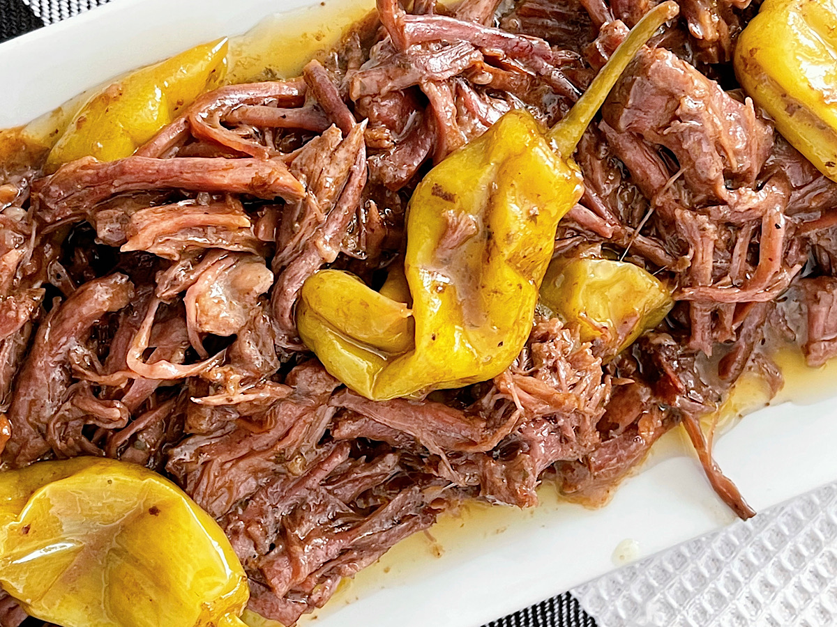 Mississippi Pot Roast made with 5 ingredients on a white plate.