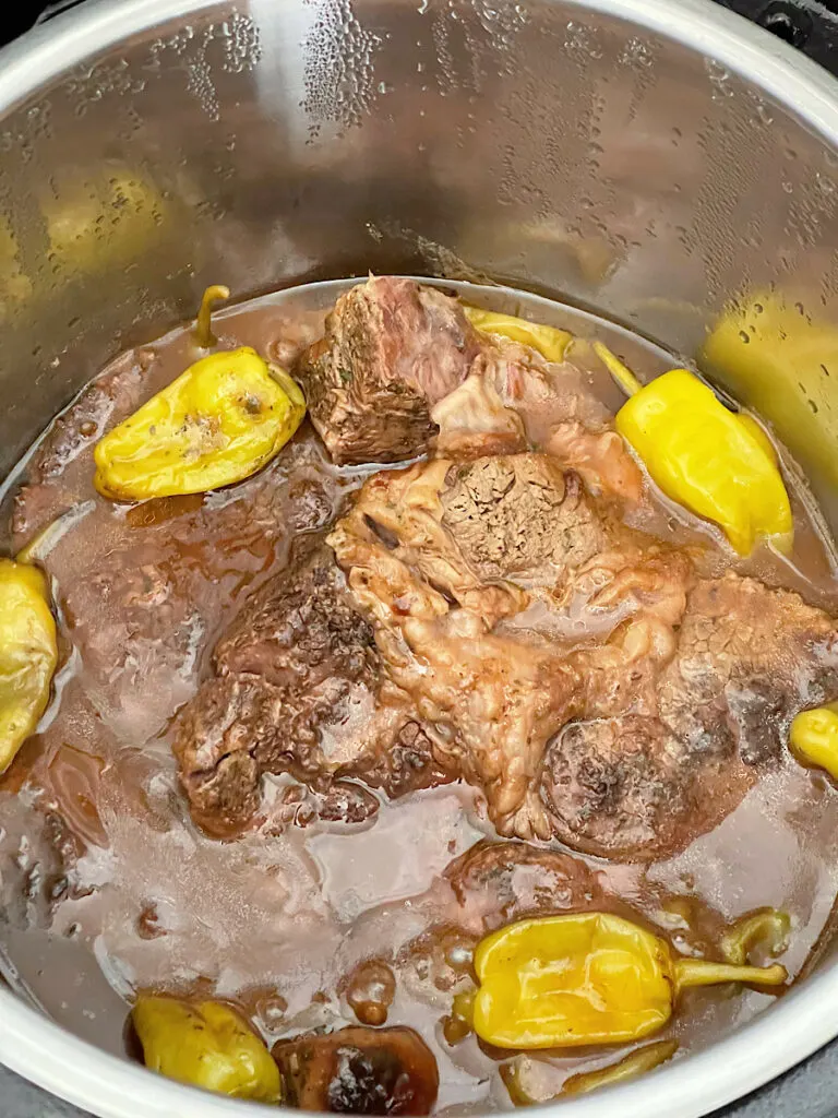 Mississippi pot roast in gravy in a slow cooker.