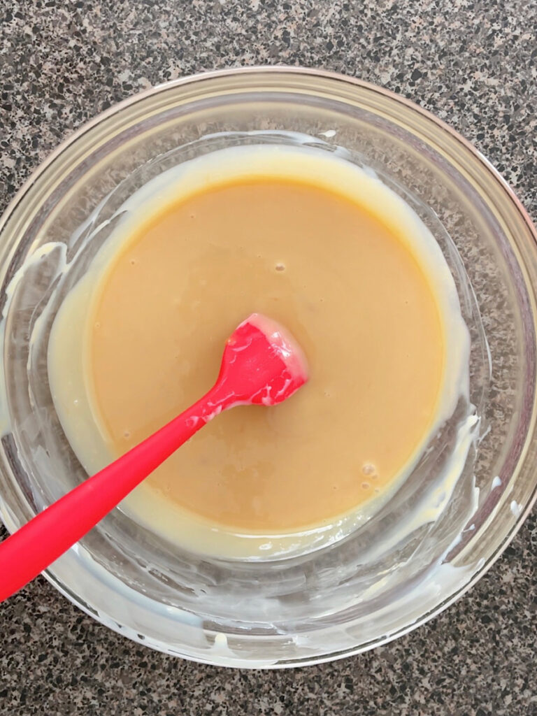 Caramel and sweetened condensed milk in a mixing bowl.