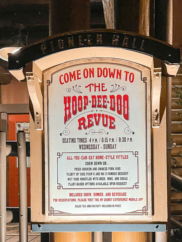 A sign outside Pioneer Hall showing Hoop-Dee-Doo Musical Revue showtimes.
