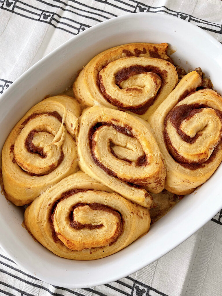 Cinnamon rolls in a baking dish.