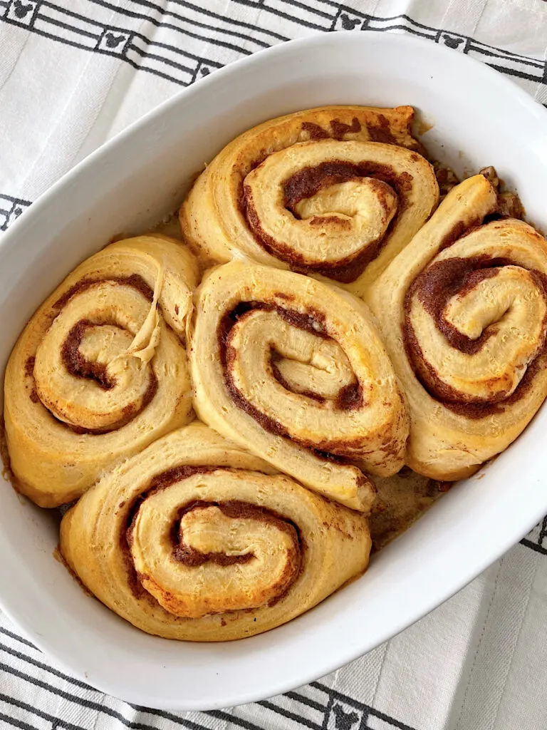 Cinnamon rolls in a baking dish.