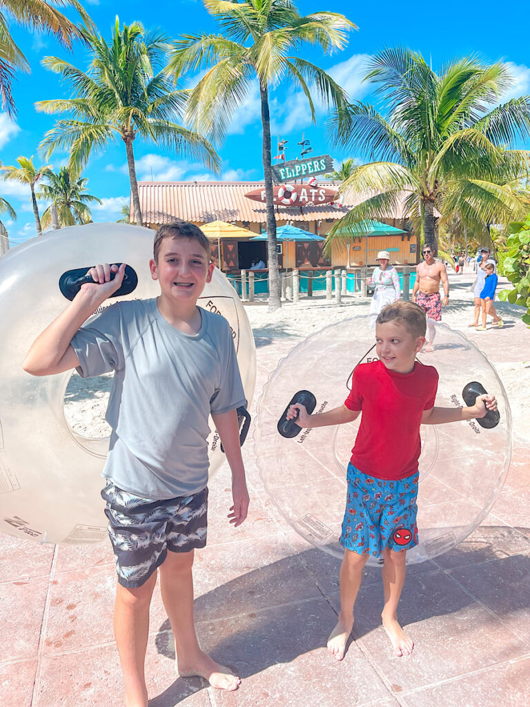 Two kids with float tubes on Disney's Castaway Cay.