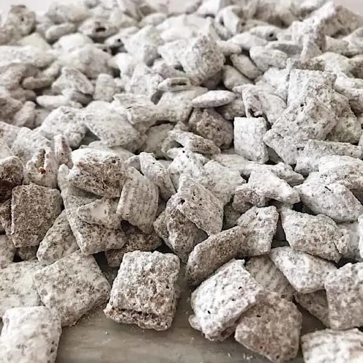 Chex muddy buddies on parchment paper.