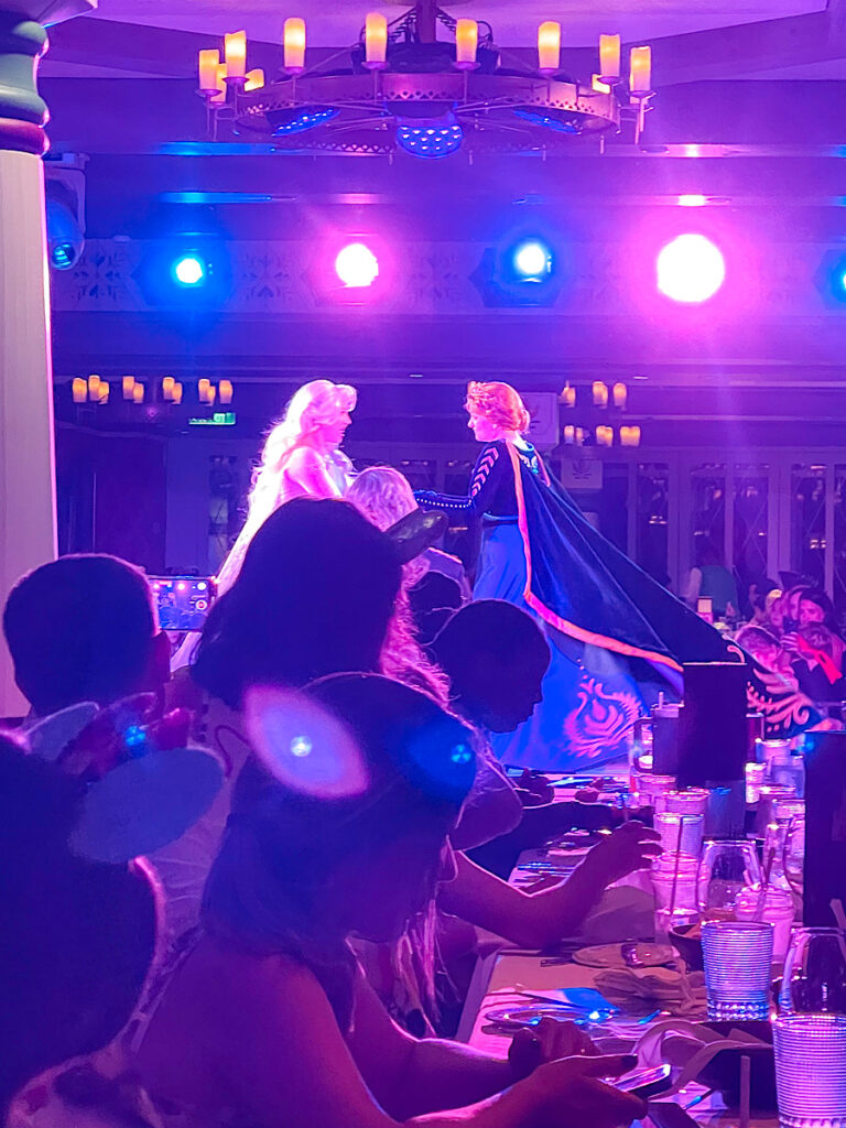 Ana and Elsa singing in the dinner show at Arendelle on the Disney Wish.