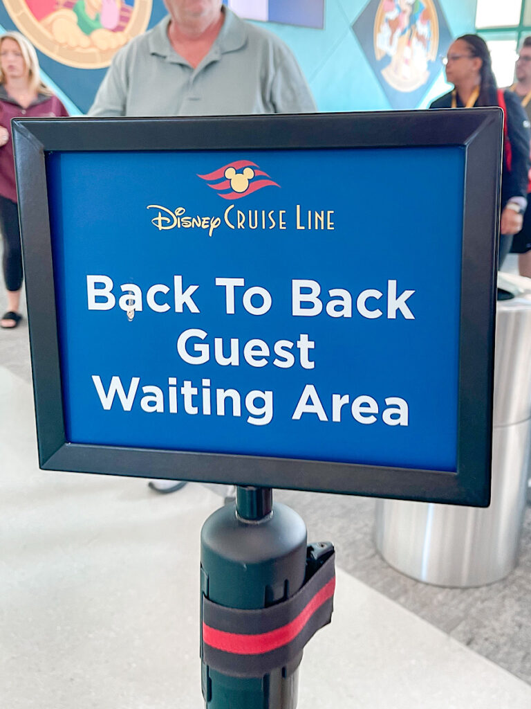 Sign for the back to back guest waiting area in the Disney Cruise terminal.