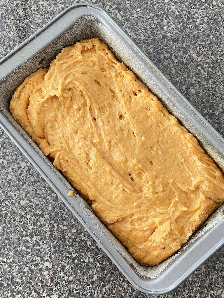 Pumpkin bread batter in a loaf pan.