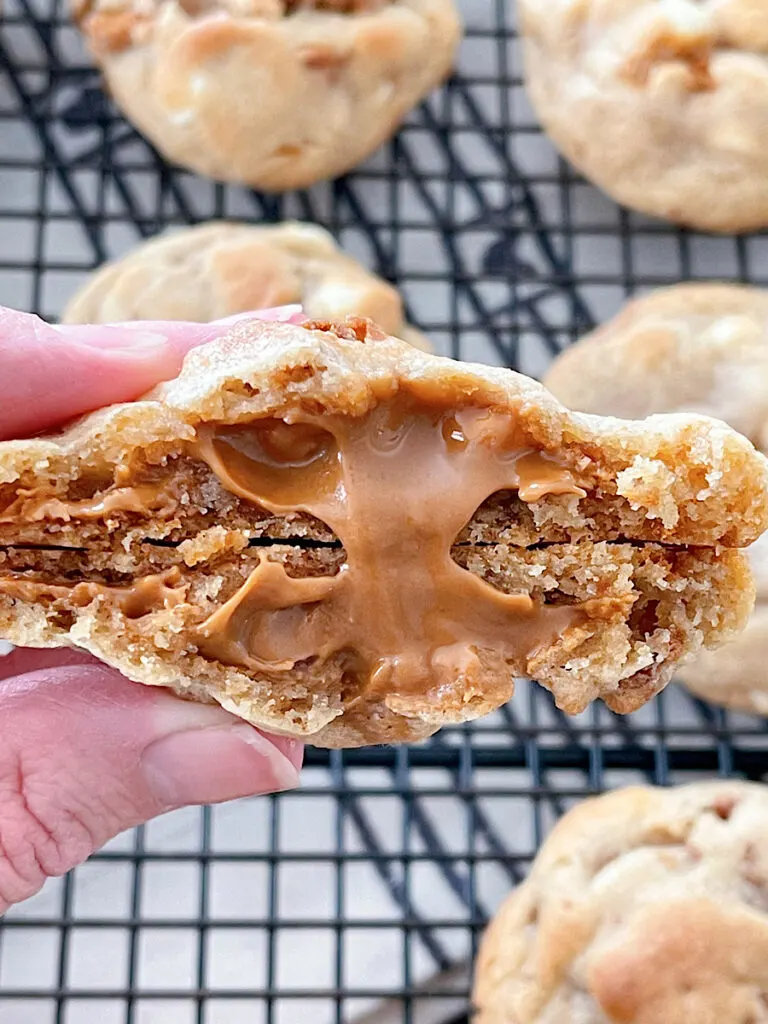 Biscoff cookie butter oozing out of a cookie butter cookie.