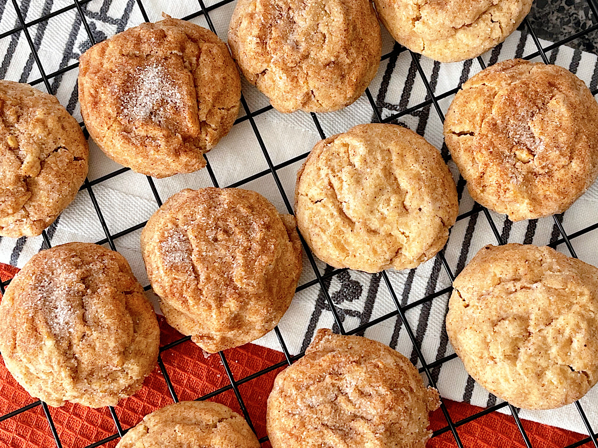 Pumpkin snickerdoodles on a cooling rack.