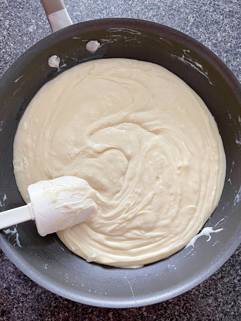 White chocolate fudge in a sauce pan.