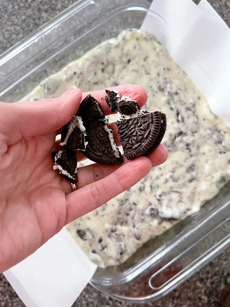 Crushed Oreos over a dish of cookies & cream fudge.