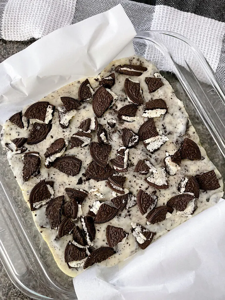 A dish of cookies & cream fudge topped with crushed OREO cookies.