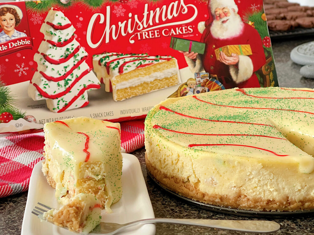 A cheesecake made stuffed with Little Debbie Christmas Tree Cakes.